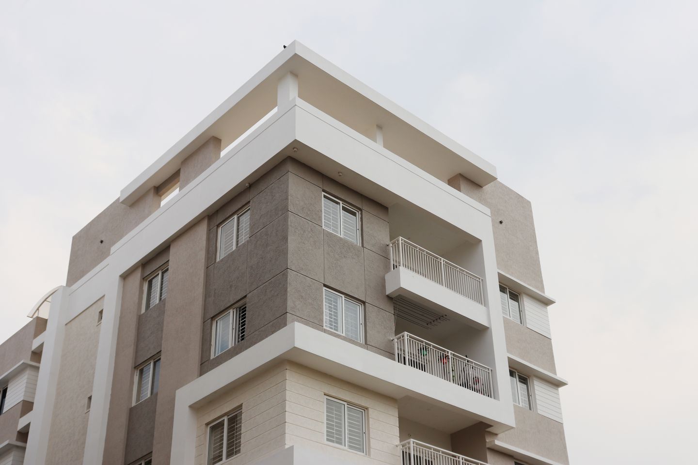 Contemporary apartments with stone-clad exteriors and spacious balconies